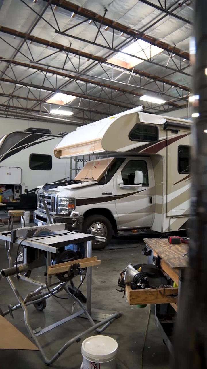 Cab-over motorhome awning repair in progress in the shop